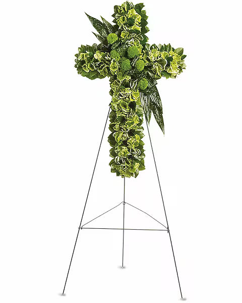 Green floral cross on a stand