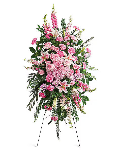 Pink and white flowers floral arrangement on a stand