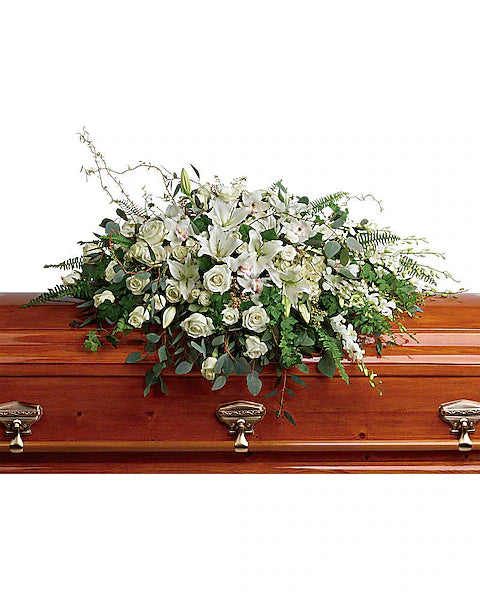 Wooden coffin with a floral arrangement 