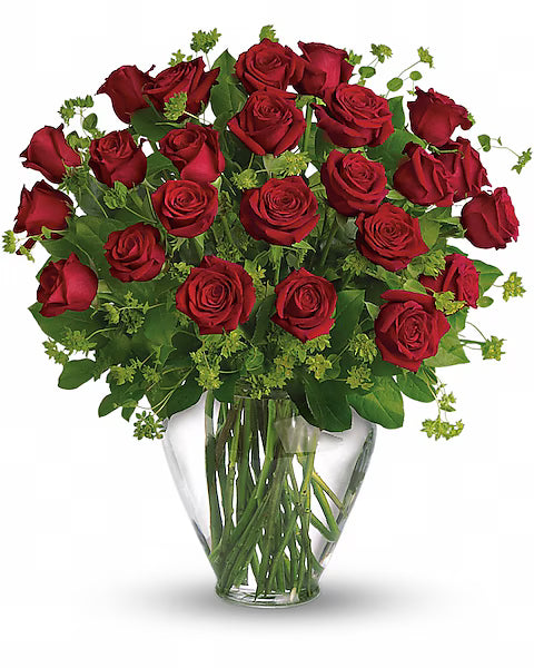 Bouquet of red roses in a clear vase on a white background