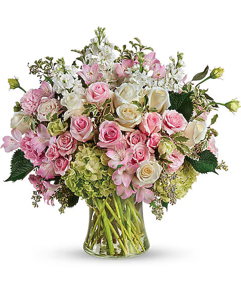 Decorative Bouquet of pink, white, and green flowers in a clear vase 